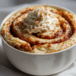 Cottage Cheese Cinnamon Roll Mug Cake with cinnamon swirl and frosting