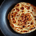 2-Ingredient Cottage Cheese Flatbread – Soft, Flexible & High-Protein 2 2-Ingredient Cottage Cheese Flatbread cooking in skillet