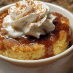 Apple Cinnamon Cottage Cheese Mug Cake – Warm, Protein-Packed & Fall-Inspired 6 Apple Cinnamon Cottage Cheese Mug Cake served warm in a mug on a kitchen table