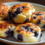 Blueberry Lemon Cottage Cheese Pancake Bites – Zesty, Juicy & Protein-Packed 6 Blueberry Lemon Cottage Cheese Pancake Bites on a plate in a cozy kitchen.