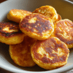 Pumpkin Spice Cottage Cheese Pancake Bites – Fluffy, Sweet & Low-Sugar 6 Pumpkin spice cottage cheese pancake bites served on a plate in a cozy kitchen