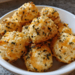 Golden protein bites fresh from the oven on parchment paper