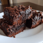 cottage cheese brownies stacked on plate