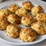 Golden cheesy ranch protein bites on parchment paper