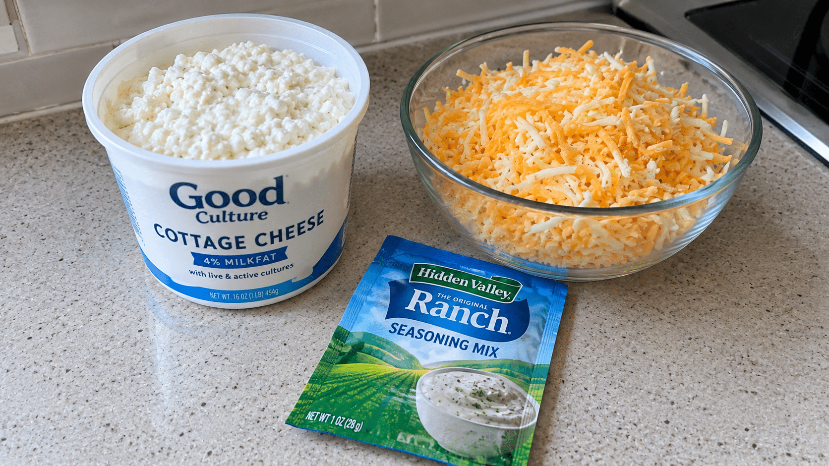 Cottage cheese, shredded cheese, and ranch seasoning measured for protein bites