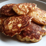 stack of yogurt pancakes topped with apple slices